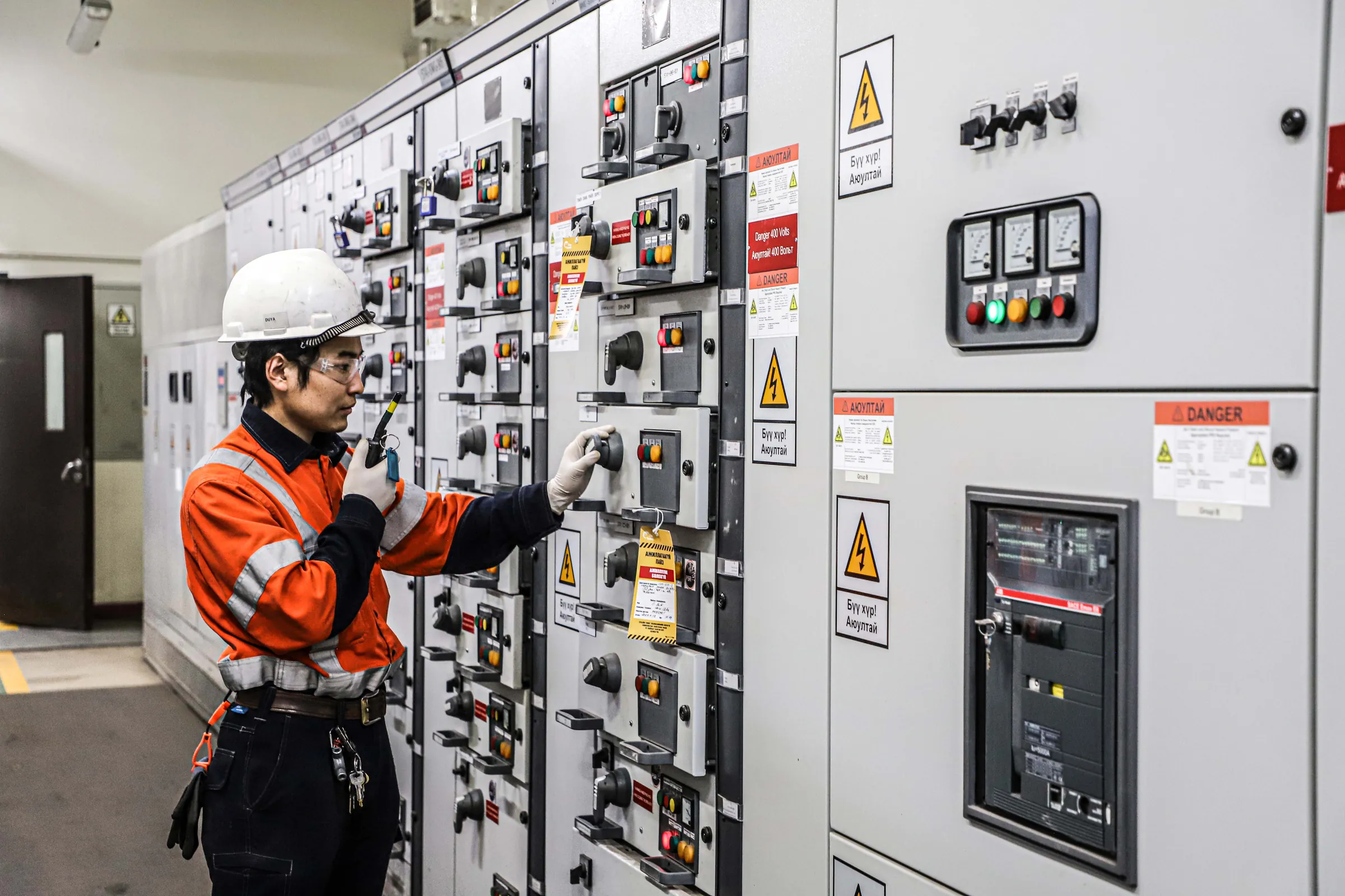 CHP electrical technician operating switchgear
