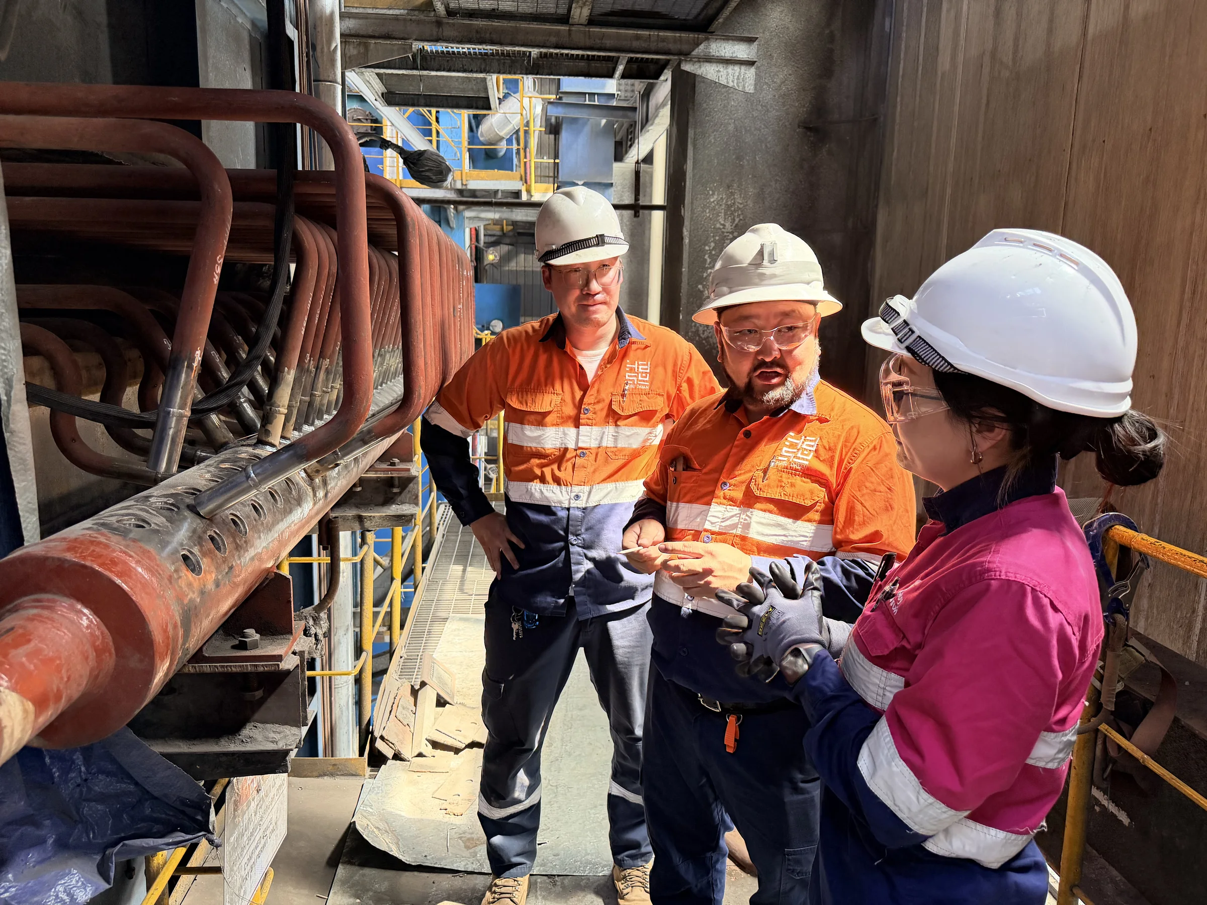 Hasu Dayan team inspecting boiler heating-surface tubing at Ukhaa Khudag Power Plant